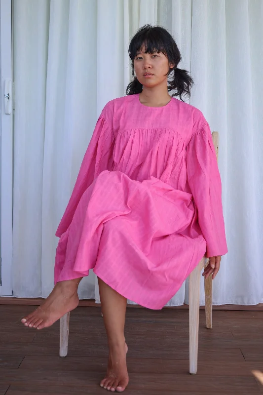 Redefining Women's Style Upper Bust gathered dress with flared sleeve.